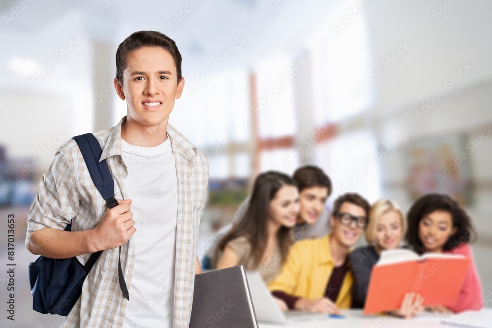 Casual man standing in modern office. Group meeting. Casual man standing in modern office. Group meeting.