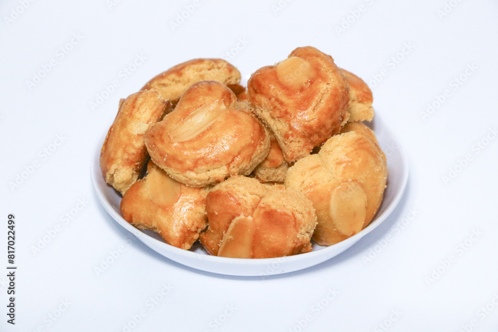peanut almond cookies topped with sliced peanuts.