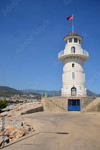 a white lighthouse with a blue door no people copy space  