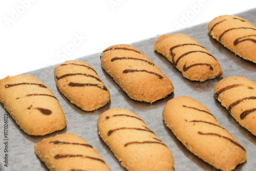 Kue lidah kucing or cat's tongue cookies. traditional cookies for eid holiday in indonesia. kue lebaran.