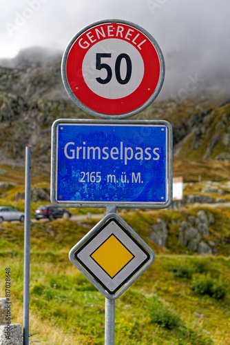 Close-up of traffic sign at summit of Swiss mountain pass Grimsel 2165 meters above sea level on a cloudy late summer day. Photo taken September 19th, 2023, Grimsel, Canton Bern, Switzerland.