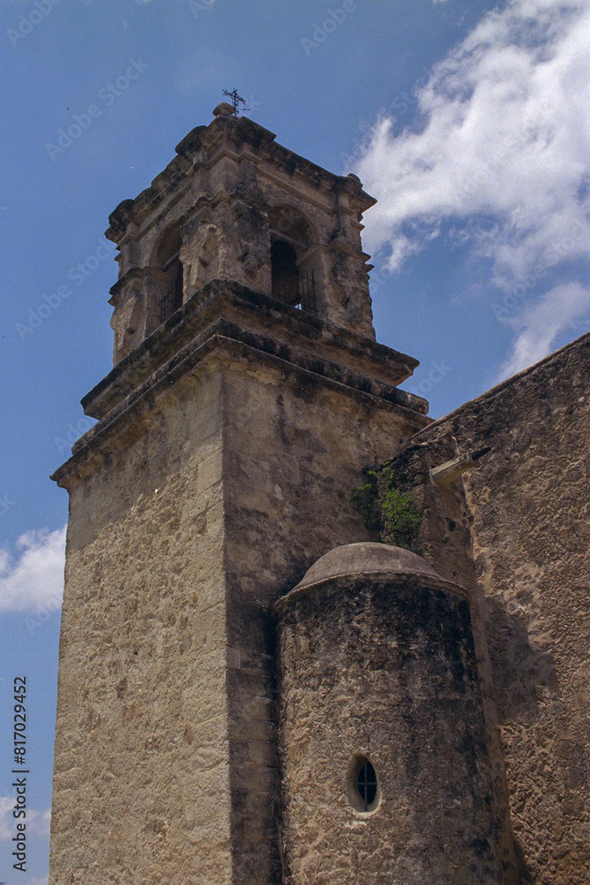 Time-worn elegance: An ancient bell tower stands watch under a serene sky. Time-worn elegance: An ancient bell tower stands watch under a serene sky.