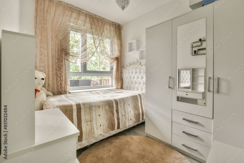 Cozy bedroom with a large window and soft natural light