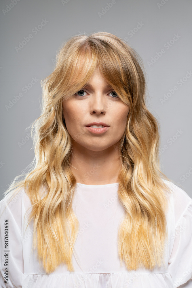 Close-Up Portrait of Woman with Wavy Blonde Hair - Modern and Natural Close-Up Portrait of Woman with Wavy Blonde Hair - Modern and Natural