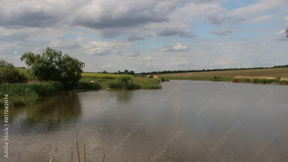 A body of water with a sign on it A body of water with a sign on it