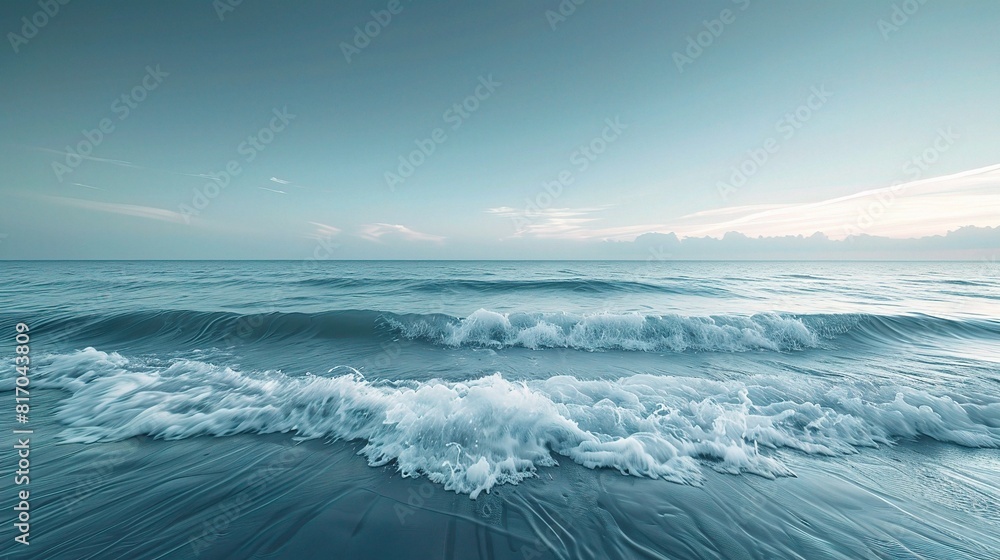 Obraz premium Ocean waves roll in, cresting and crashing on a sandy beach