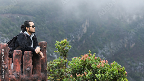 Billede på lærred a man enjoying the fresh air and beautiful views in the misty Tangkuban Parahu m