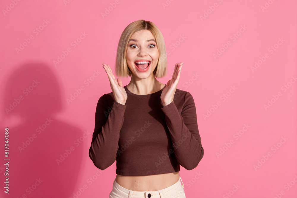 Photo of lovely cheerful positive girl wear trendy brown clothes rejoice success isolated on pink color background Photo of lovely cheerful positive girl wear trendy brown clothes rejoice success isolated on pink color background