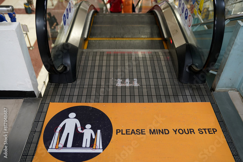 Warning sign on the escalator for safety