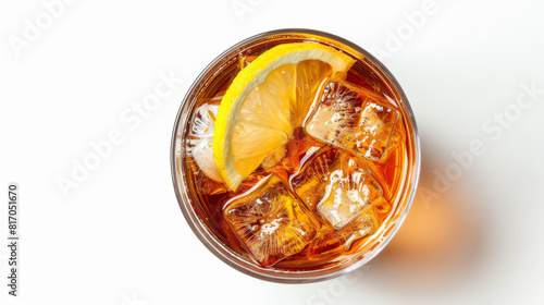 A glass of iced tea with a lemon wedge in it