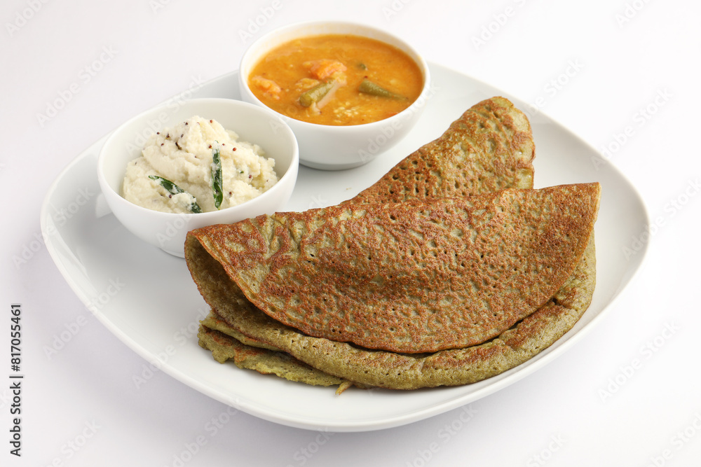 Pesarattu Dosa or moong dosai is Indian breakfast crepes with green gram served with sambar chutney Pesarattu Dosa or moong dosai is Indian breakfast crepes with green gram served with sambar chutney