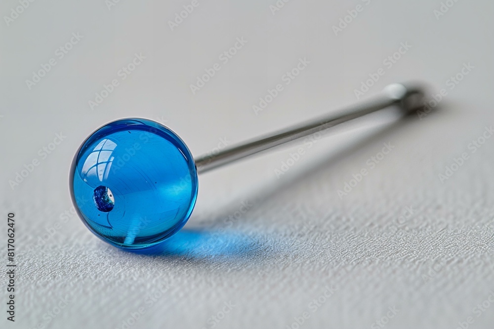 Blue glass orb on metallic rod Blue glass orb on metallic rod