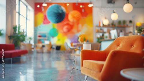An abstract blurred image of a creative office space with colorful furniture and artistic decorations