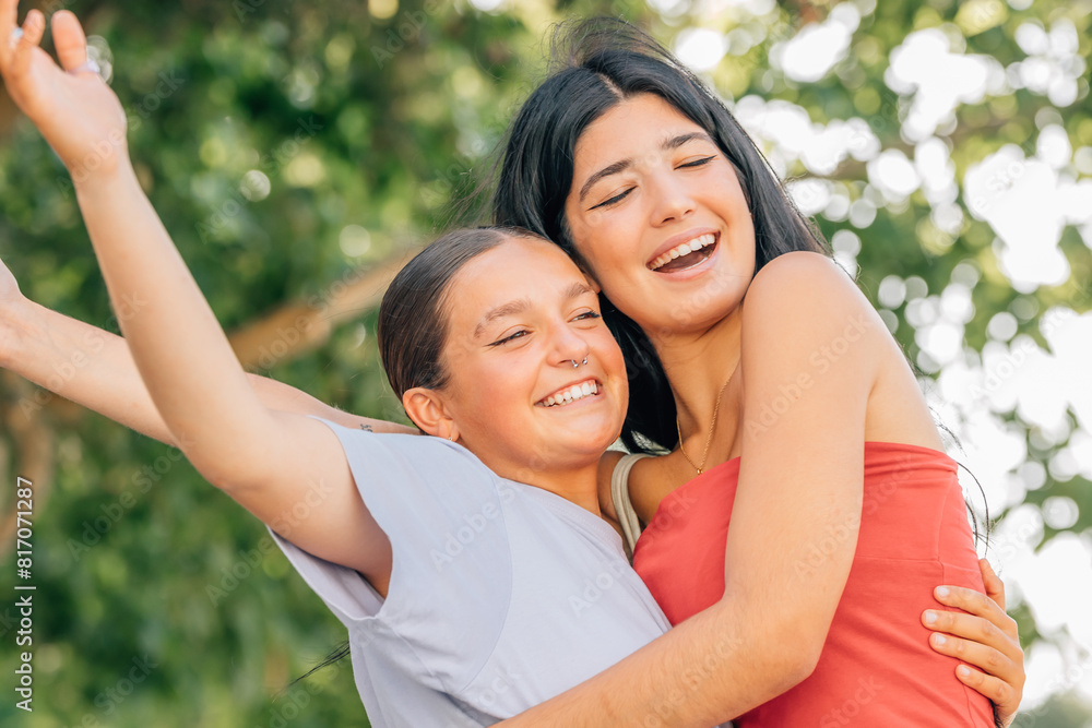 happy friends hugging laughing out loud in summer outdoors happy friends hugging laughing out loud in summer outdoors