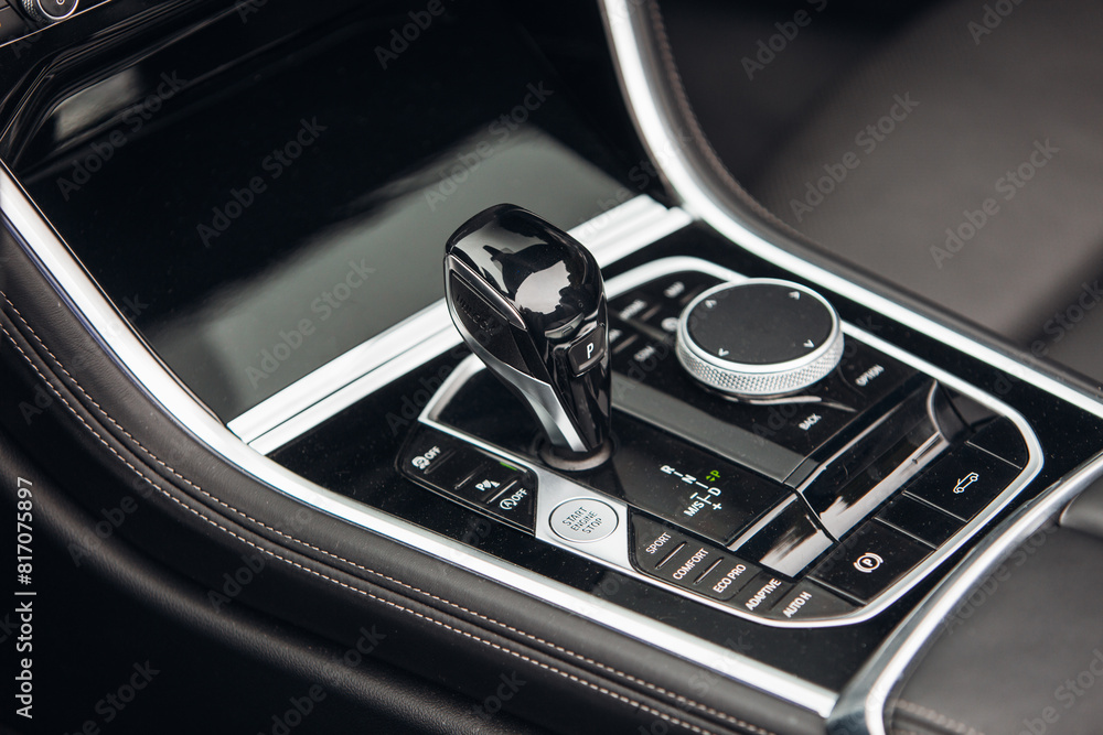 Modern and expensive car interior and gearbox shift handle Modern and expensive car interior and gearbox shift handle