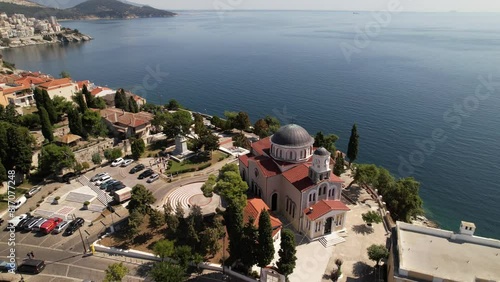 Witness the charming town of Kavala in Greece as it gracefully merges with the vast blue ocean. From colorful rooftops to winding streets, the town comes alive in this stunning aerial view
