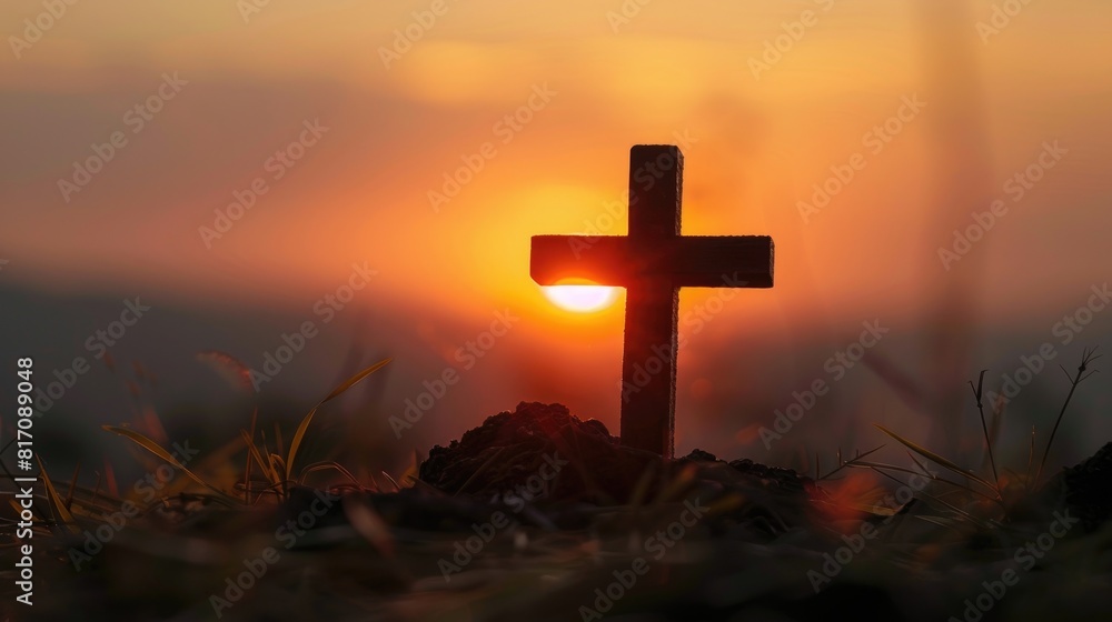 A Christian cross stands in silhouette against the backdrop of a sunset embodying themes of faith forgiveness salvation and the resurrection of Jesus Christ A Christian cross stands in silhouette against the backdrop of a sunset embodying themes of faith forgiveness salvation and the resurrection of Jesus Christ