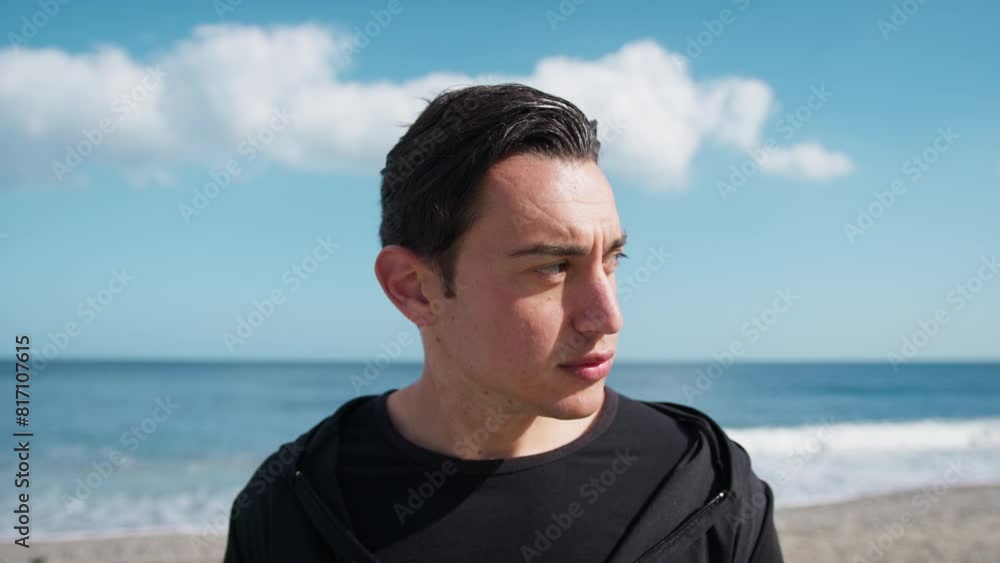 Man Sad Looks Left And Right On The Beach Near The Sea
