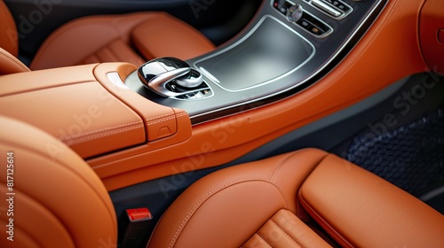 Close up of the interior in an orange leather luxury dashboard on sport car.