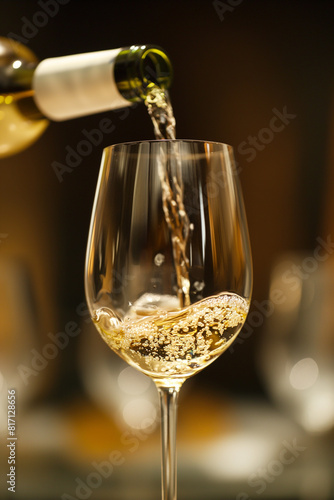 White wine poured in glass