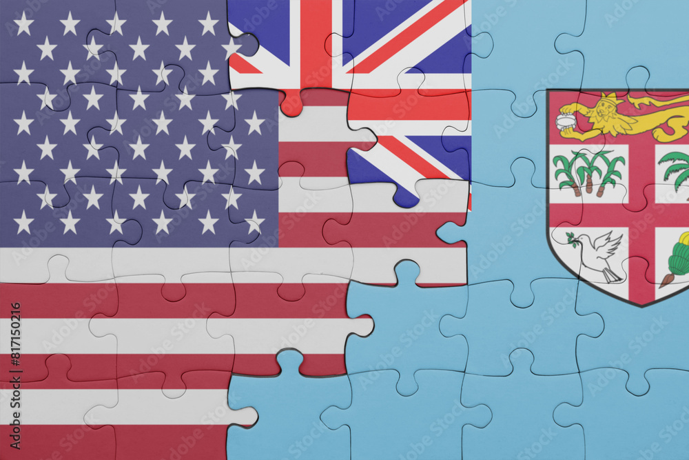 Obraz premium puzzle with the colourful national flag of Fiji and flag of united states of america .