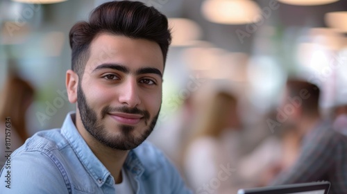 The close up picture of middle eastern male is working as marketing professional inside office, the marketing professional require skills like market research, digital marketing and creative . AIG43.