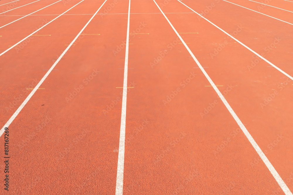 Synthetic track with white lines in the athletics stadium.. Synthetic track with white lines in the athletics stadium..
