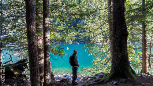 Woman in forest with lake