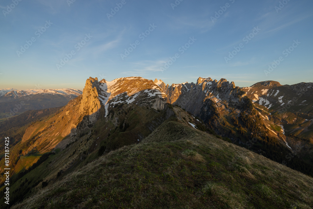 Sunset in the mountains, Saxer Gap mountain ridge swiss Alpstein alpine Appenzell Innerrhoden Switzerland, a steep ridge of the majestic Schaefler peak in the Alpstein mountain. Sunset in the mountains, Saxer Gap mountain ridge swiss Alpstein alpine Appenzell Innerrhoden Switzerland, a steep ridge of the majestic Schaefler peak in the Alpstein mountain.