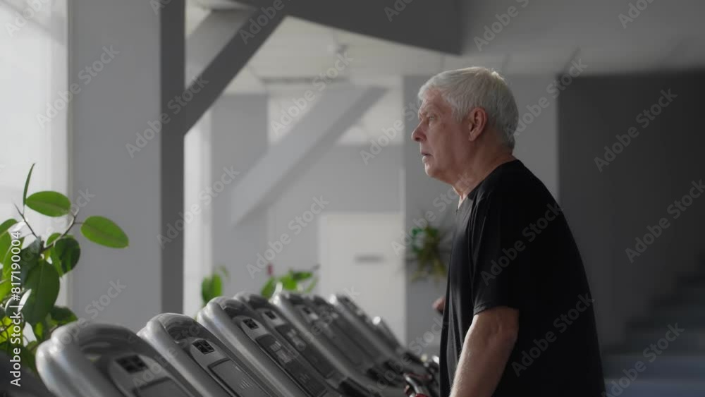 An elderly man on a treadmill An elderly man on a treadmill