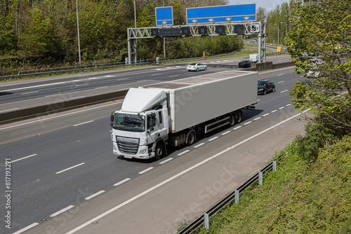 Tableau sur toile White articulated lorry travelling on the motorway.