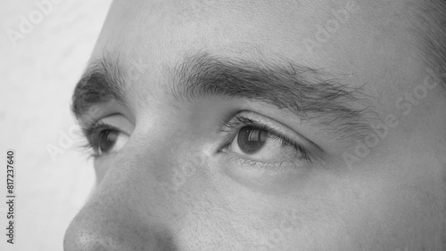 Close-up of the eyes of a tired sleep-deprived young man photo