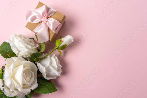 Creative layout made with flowers on pink backdrop. Spring minimal concept.