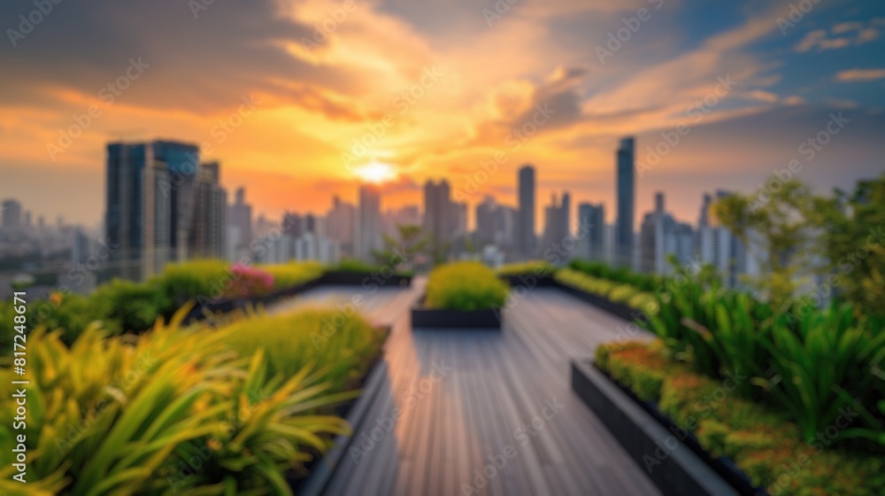 This blurred image captures the essence of a sunset over a city skyline, viewed from a lush rooftop garden with a serene ambiance. Resplendent.