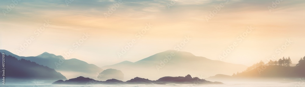 Fototapeta premium A misty sunrise over the ocean with fog obscuring the view. 