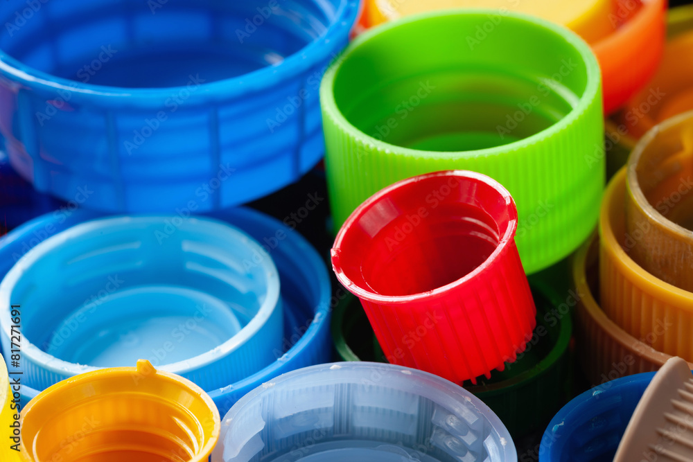 Plastic lids. Colored plastic caps. Recycling of plastic. Selective focus Plastic lids. Colored plastic caps. Recycling of plastic. Selective focus