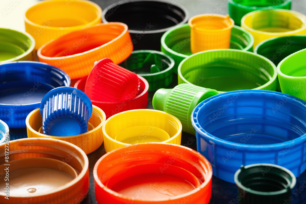 Plastic caps. Multi-colored plastic caps. Recycling of plastic. Selective focus Plastic caps. Multi-colored plastic caps. Recycling of plastic. Selective focus
