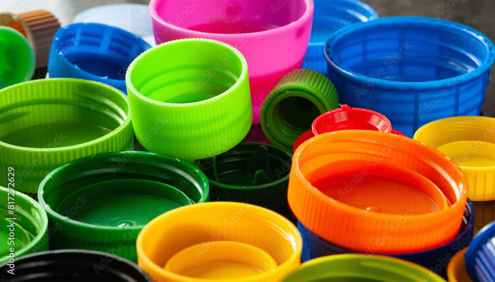 Plastic lids. Multi-colored plastic caps. Recycling of plastic Plastic lids. Multi-colored plastic caps. Recycling of plastic