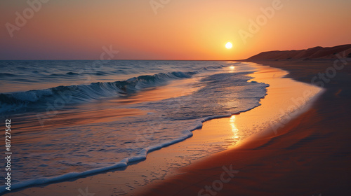 the sunset on the sandy beach near the blue ocean in the summer