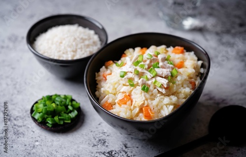 Asian rice chicken soup with carrots and celery in a bowl