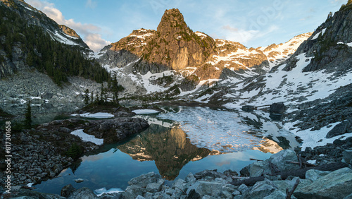 mountain lake with ice and glacier
