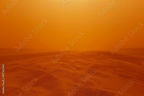 A view of a desert with a sun in the distance