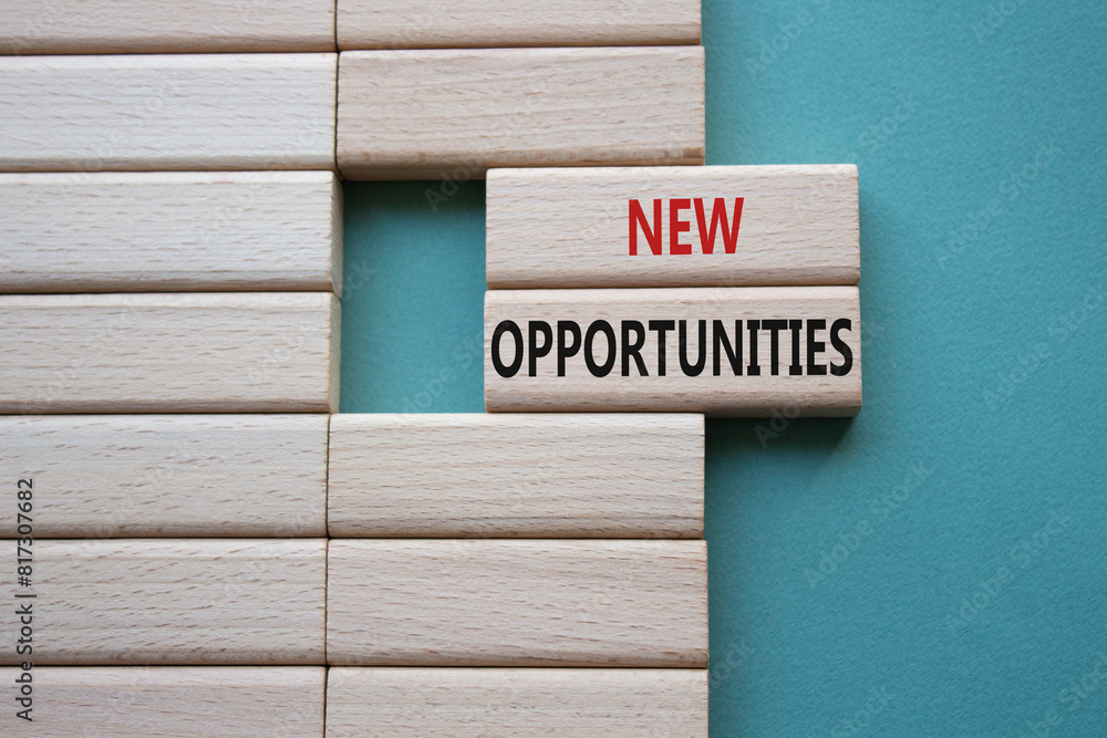 New Opportunities symbol. Concept word New Opportunities on wooden blocks. Beautiful grey green background. Business and New Opportunities concept. Copy space New Opportunities symbol. Concept word New Opportunities on wooden blocks. Beautiful grey green background. Business and New Opportunities concept. Copy space