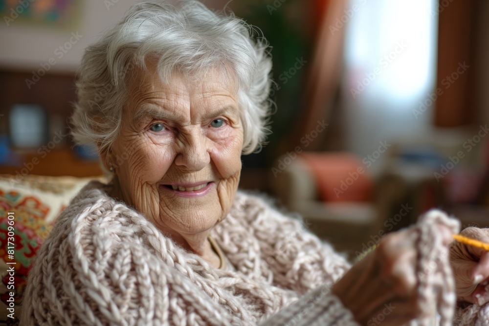 Content elderly woman smiling as she knits, seated comfortably with a sense of satisfaction Content elderly woman smiling as she knits, seated comfortably with a sense of satisfaction