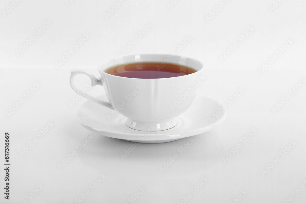 Tasty tea in cup on white background Tasty tea in cup on white background