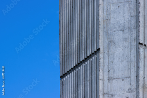 concrete column of a bridge support against a blue sky