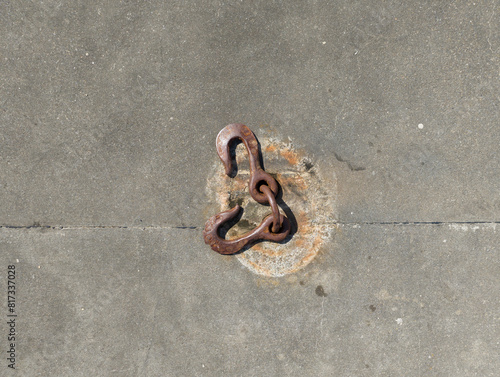 old rusty hooks on a concrete floor