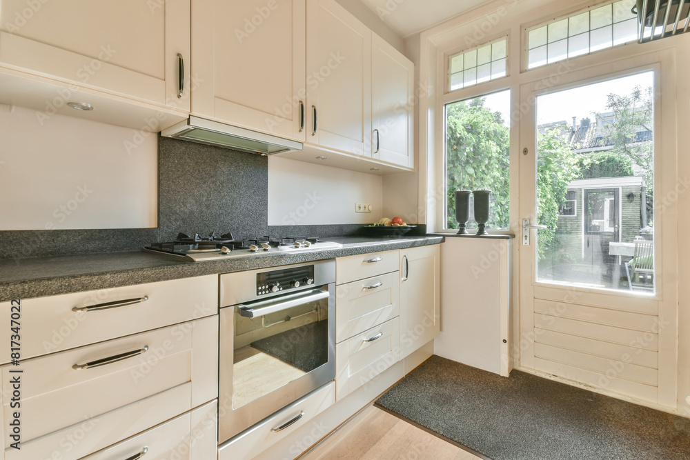 Modern kitchen interior with garden view at Meester Rendorplaan 8 Modern kitchen interior with garden view at Meester Rendorplaan 8