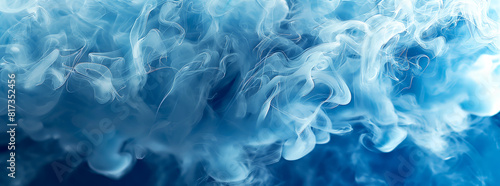 Blue smoke, with intricate swirls and curls unfolding against dark blue backdrop, creating a sense of depth and movement. Ideal for projects related to mystery, elegance, or abstract. © avitali