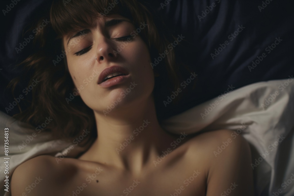 depressed young woman laying on a bed and crying depressed young woman laying on a bed and crying